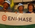 Enphase volunteers holding a GRID/Enphase banner