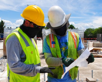 Two men reading a site map