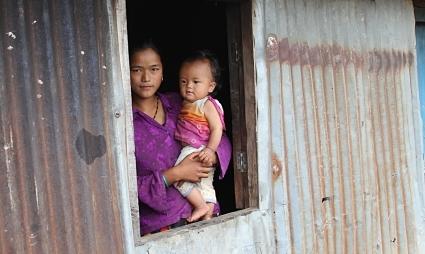 woman and baby in window