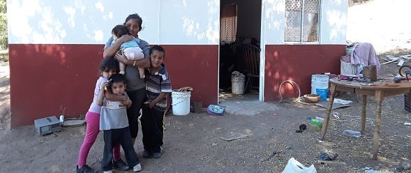 Gricelda, a Kumeyaay mom, hugs her kids